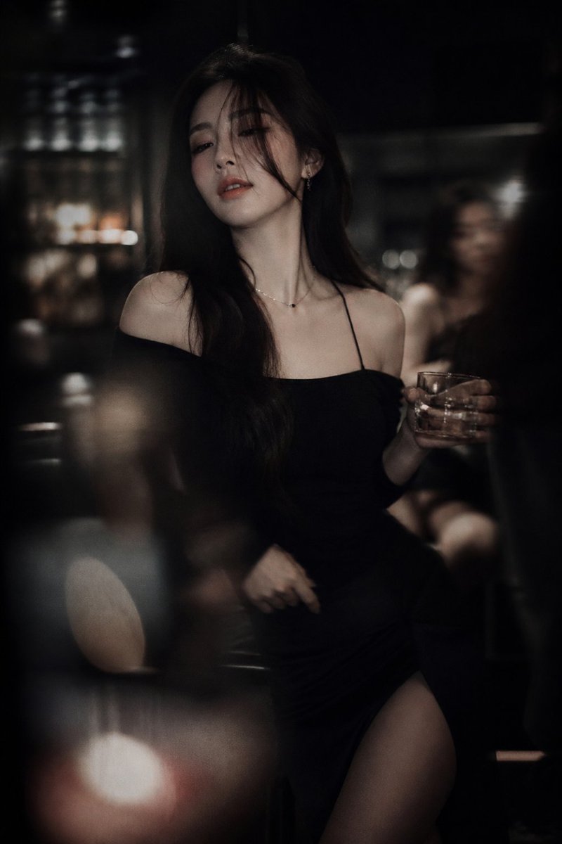 Low-light cinematic portrait, telephoto lens compression, shallow dept